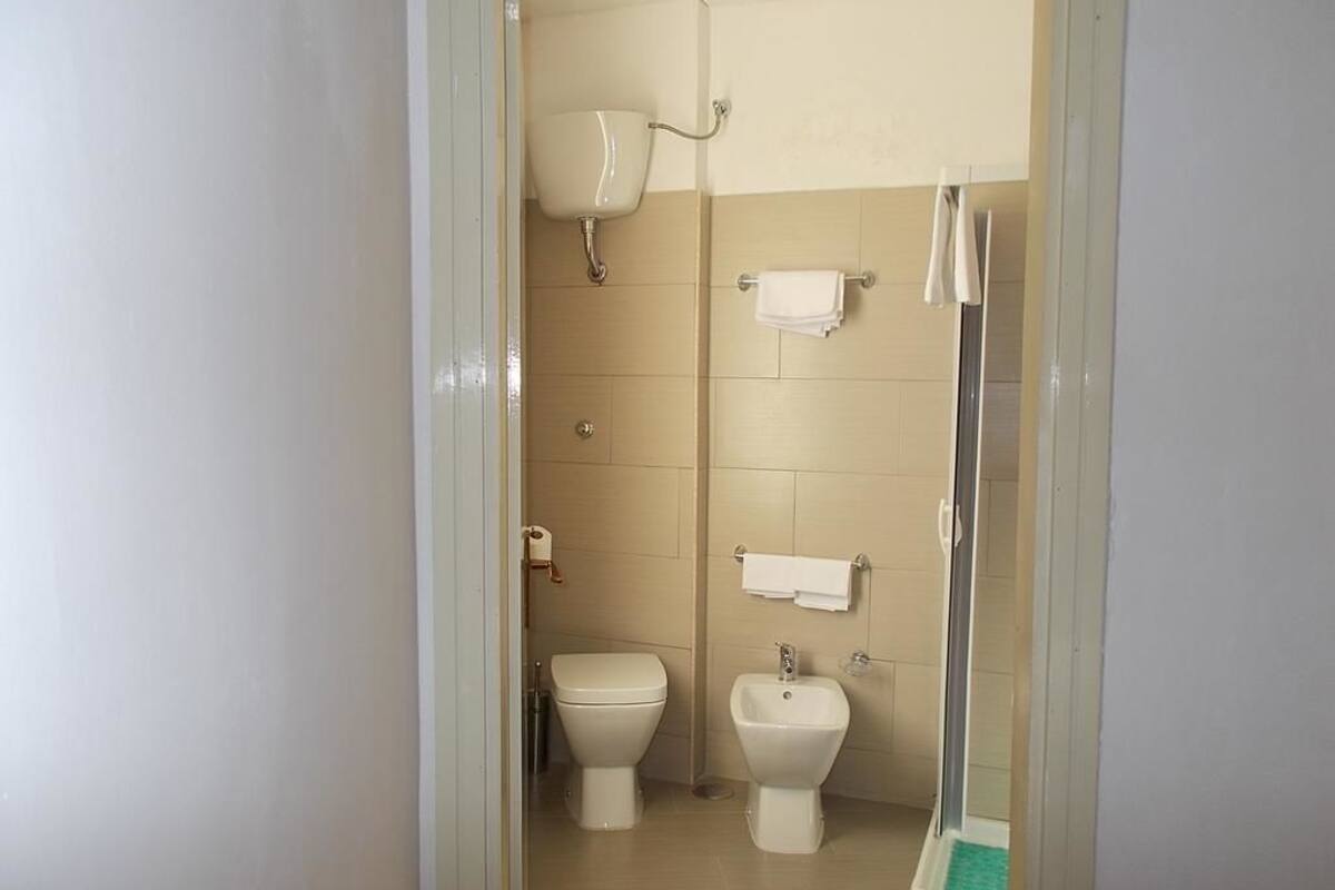 rainfall showerhead, hair dryer, bathrobes, slippers