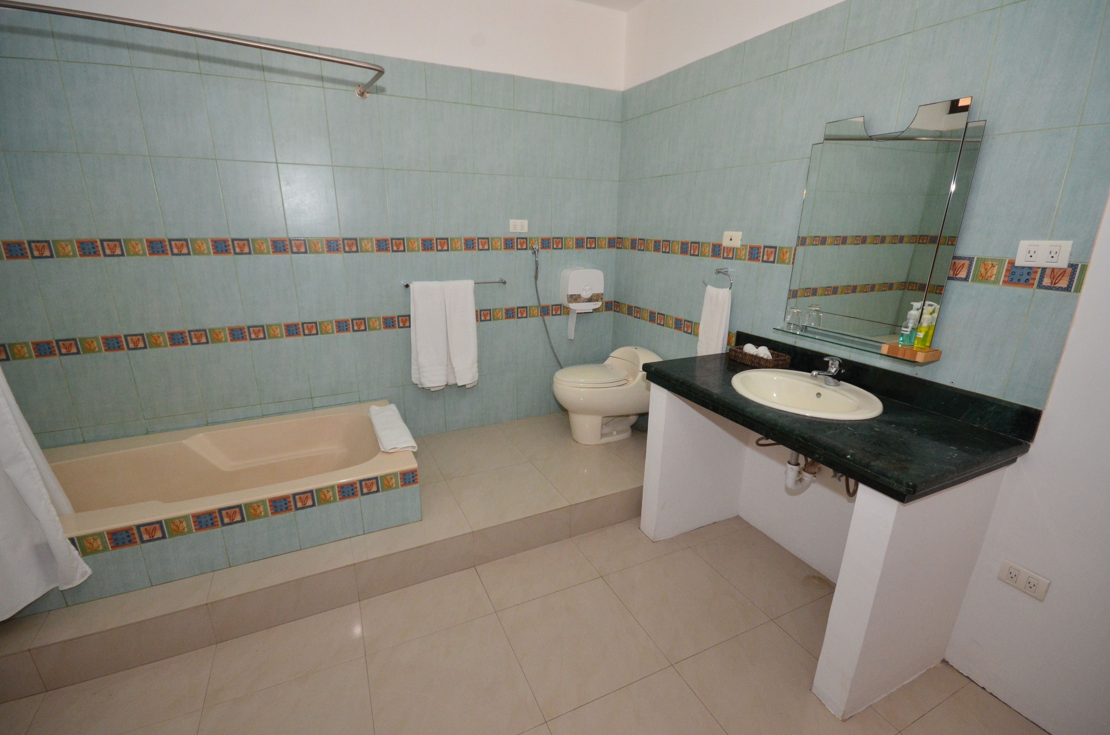 standard double room | bathroom | shower, rainfall showerhead, hair dryer, towels