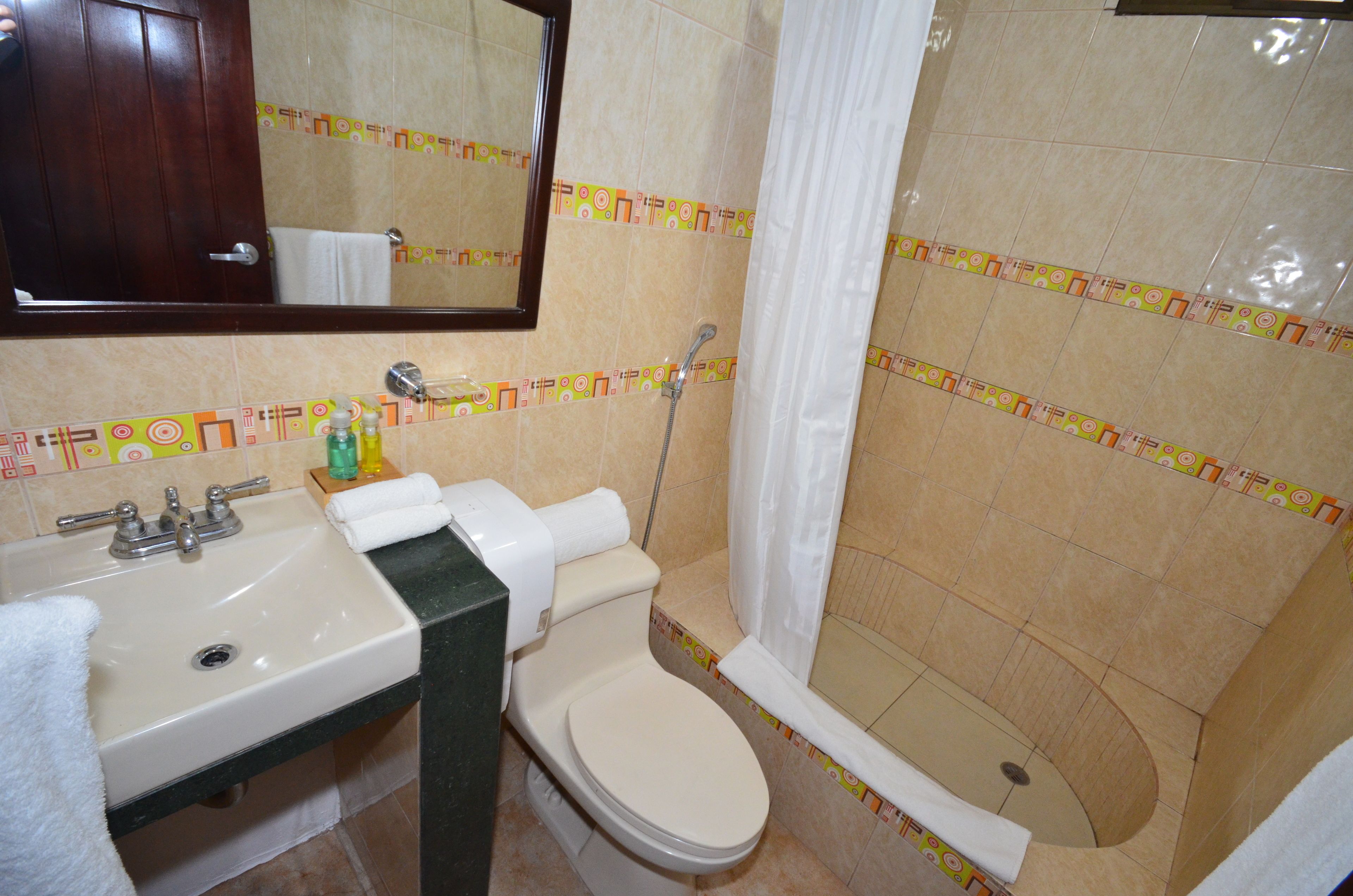 standard double room, poolside | bathroom | shower, rainfall showerhead, hair dryer, towels