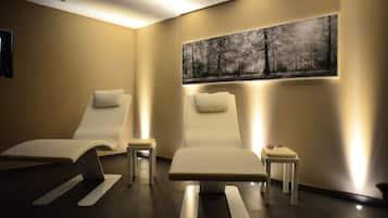 Relax in comfort with two reclining chairs and side tables, surrounded by a serene forest scene.