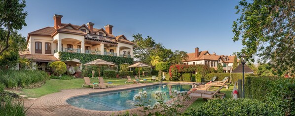 Outdoor pool, pool umbrellas, pool loungers