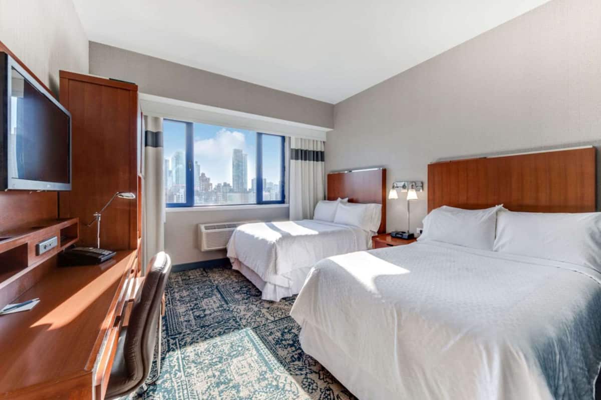 Down duvets, pillow-top beds, in-room safe, laptop workspace