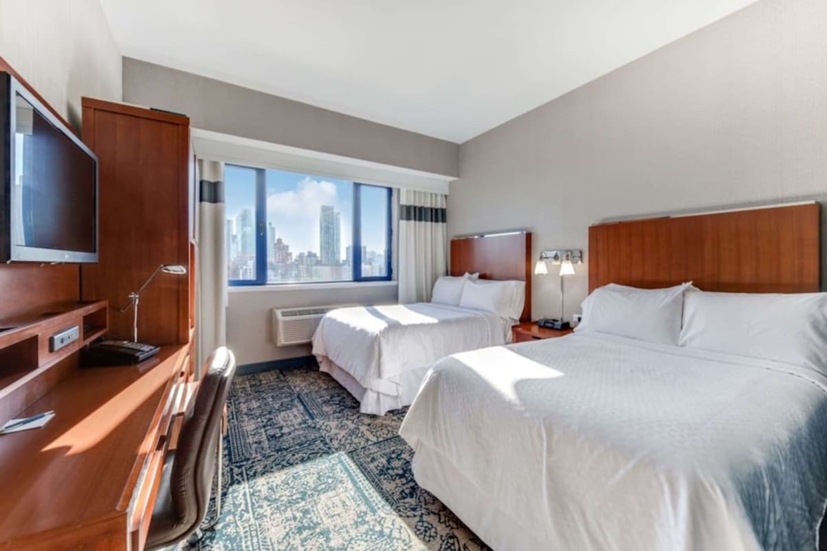 Down duvets, pillow-top beds, in-room safe, laptop workspace