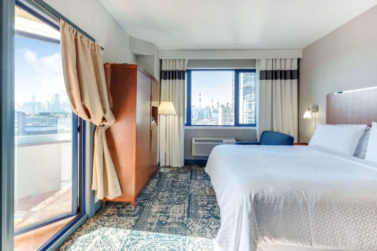 Down duvets, pillow-top beds, in-room safe, laptop workspace