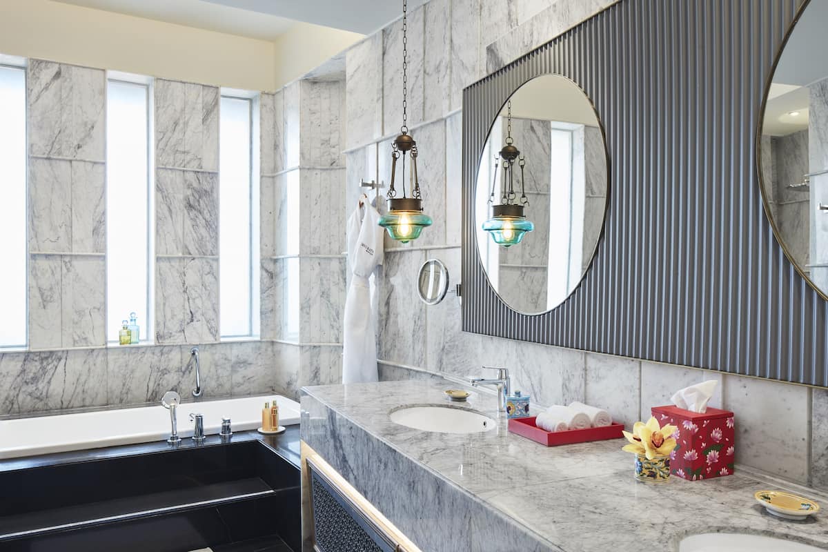 separate bathtub and shower, deep-soaking bathtub, designer toiletries