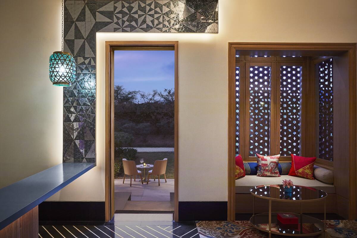 luxury suite with jacuzzi & garden sit-out | living area | 49-inch lcd tv with satellite channels, tv, dvd player