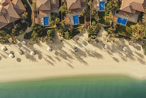 Private beach, white sand, sun loungers, beach umbrellas