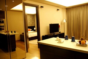One Bedroom Apartment | Living room | LED TV, iPod dock, pay movies - IIDL Suites (New Delhi)