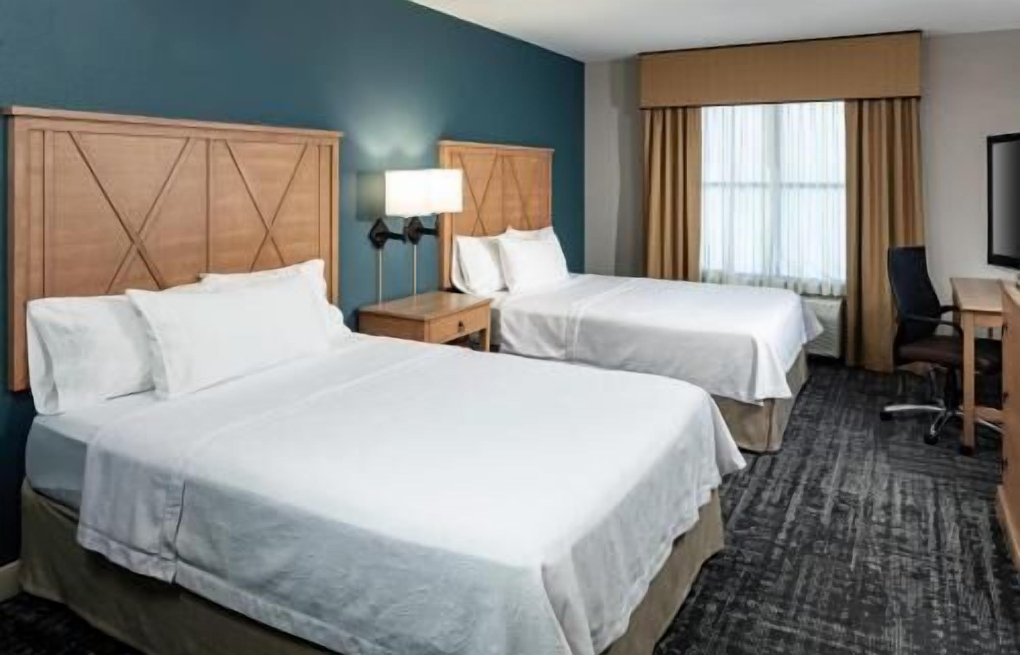 Pillow-top beds, desk, laptop workspace, blackout curtains