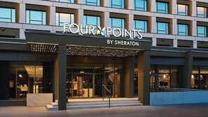 A modern hotel facade with a grid of windows and a sign reading "FOUR POINTS BY SHERATON". - Four Points by Sheraton Wroclaw (Wroclaw)