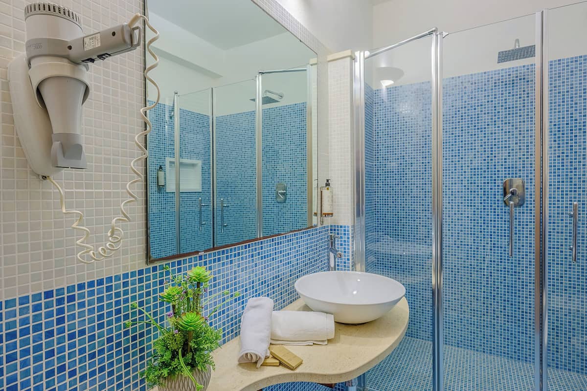 standard triple room | bathroom | shower, rainfall showerhead, designer toiletries, hair dryer