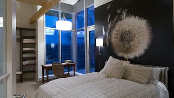Suite, 2 chambres, salle de bains privée, vue jardin | 1 chambre, fer et planche à repasser, Wi-Fi gratuit, draps fournis