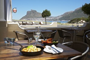 Enjoy a romantic meal for two in this beautifully set dining area with a stunning coastal view.
