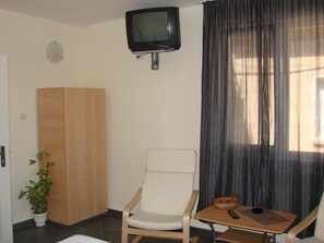 Minibar, desk, blackout curtains, iron/ironing board