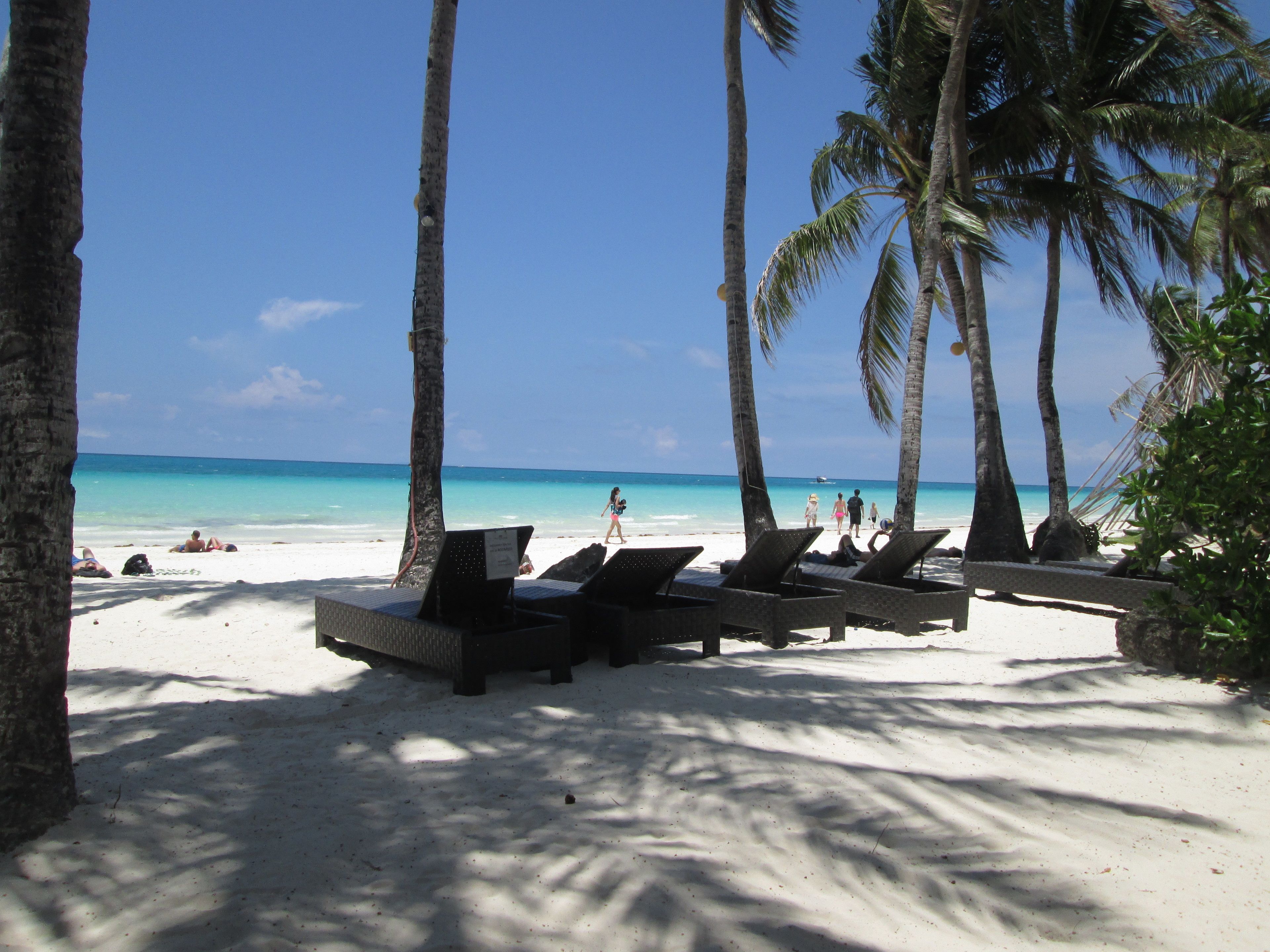 On the beach, white sand, free beach cabanas, sun loungers