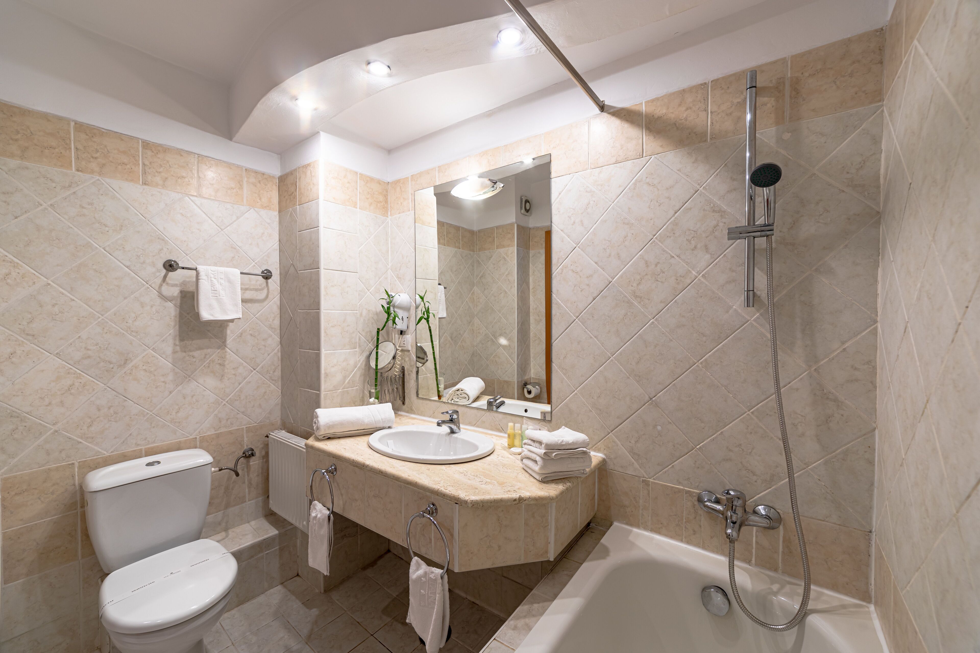 bathtub, rainfall showerhead, free toiletries, hair dryer