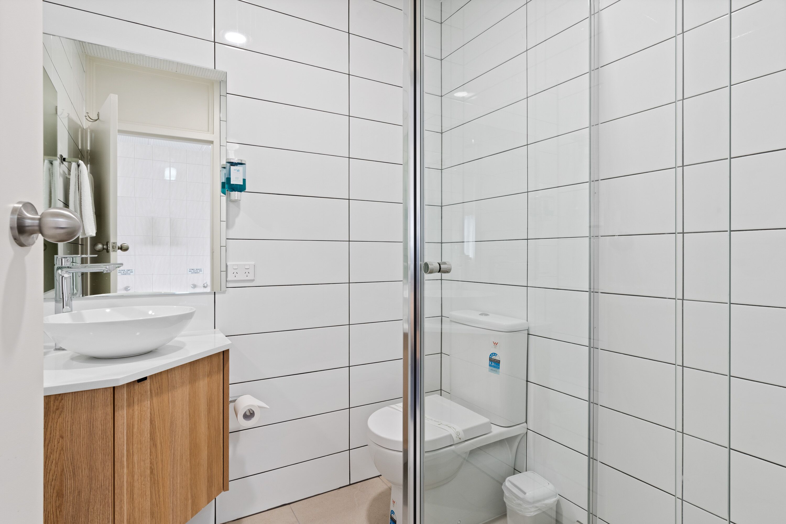 Shower, rainfall showerhead, hair dryer, towels