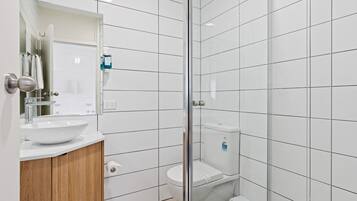 Shower, rainfall showerhead, hair dryer, towels