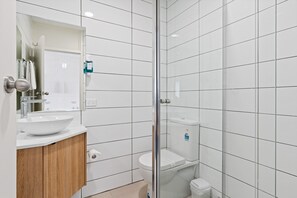 Shower, rainfall showerhead, hair dryer, towels