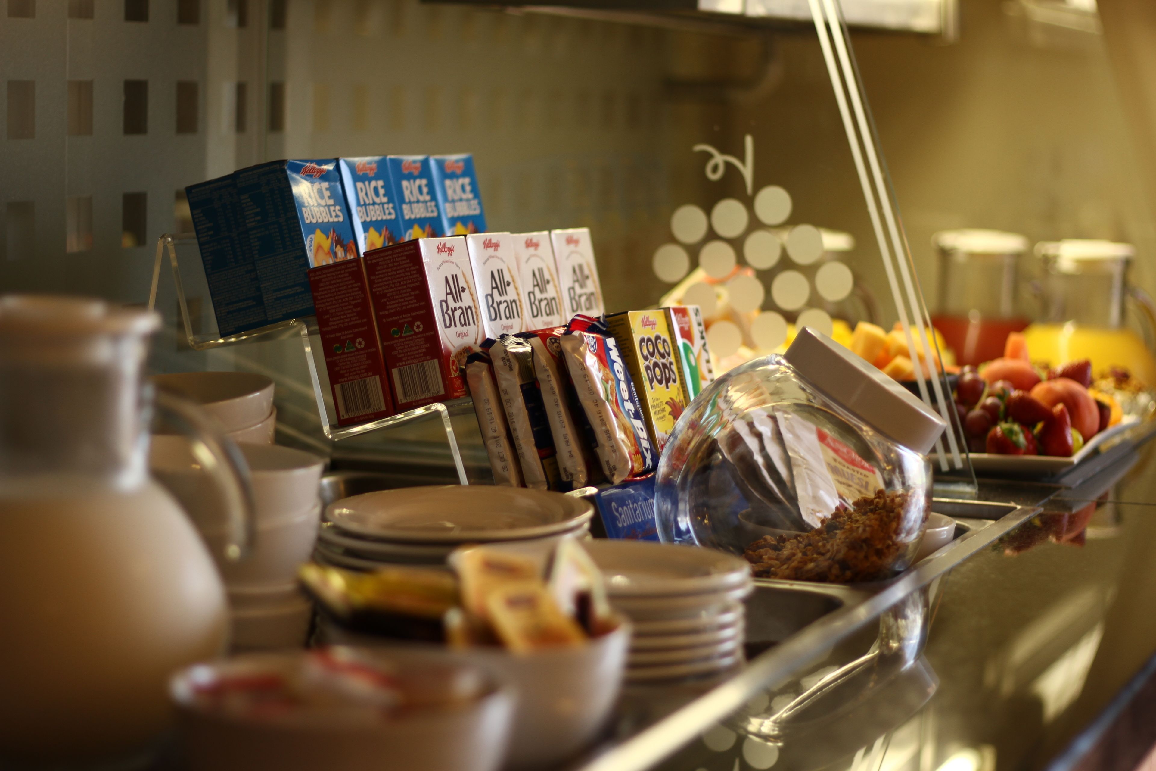 A breakfast buffet with various food items and beverages.