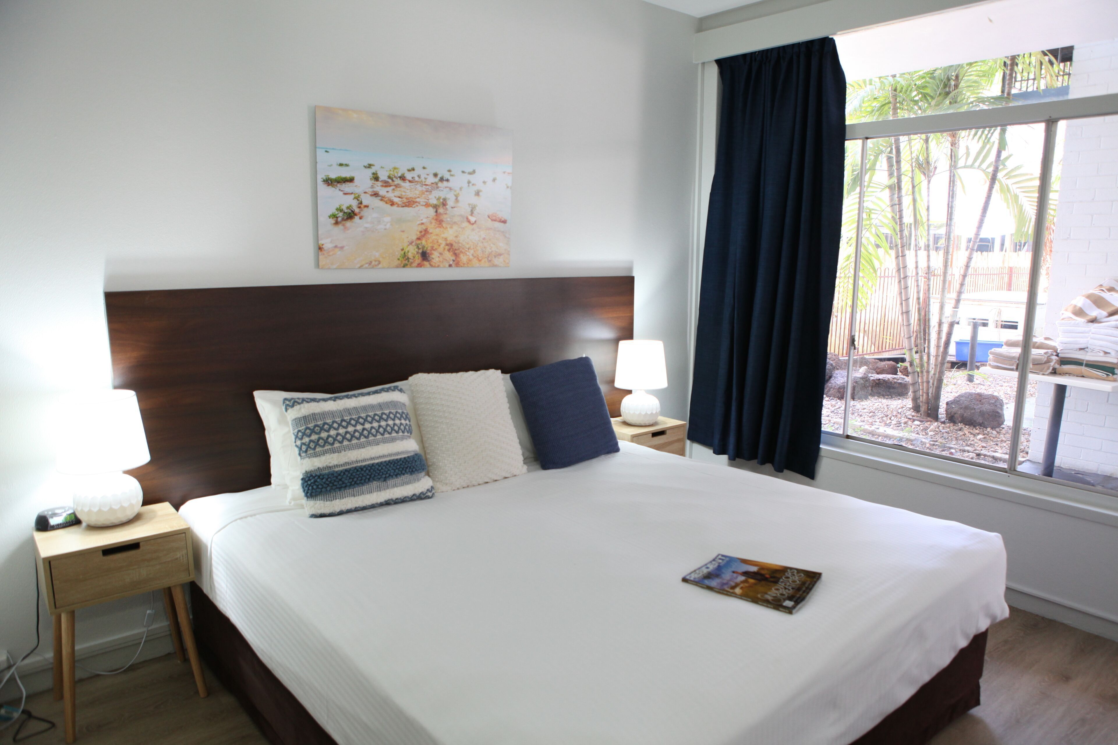 Desk, iron/ironing board, bed sheets