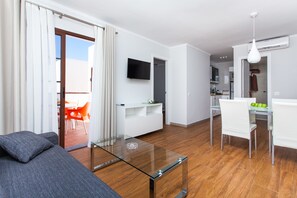 Superior Apartment, 2 Bedrooms | Living room | 21-inch flat-screen TV with satellite channels