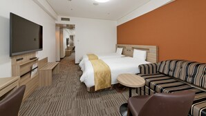 A hotel room with a large bed, a TV, a sofa, and a small table. - Hotel Sunroute Sopra Kobe (Kobe)