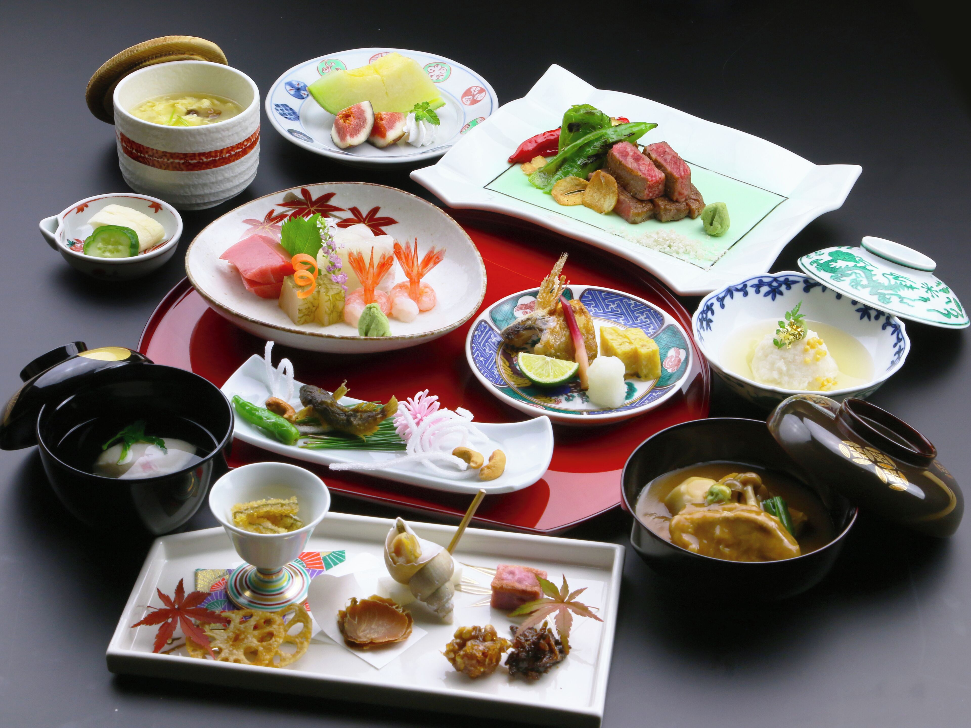 A variety of dishes and bowls on a table, suggesting a meal setting.