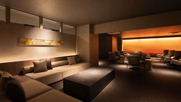 A modern lounge area with a sofa set, a coffee table, and a seating area with chairs. - Grand Mercure Nara Kashihara (Kashihara)