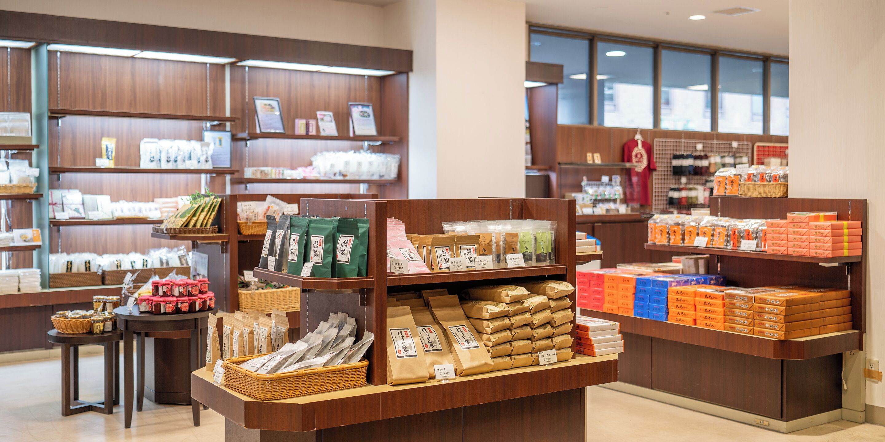 A store with shelves stocked with various packaged goods, including snacks and food items.