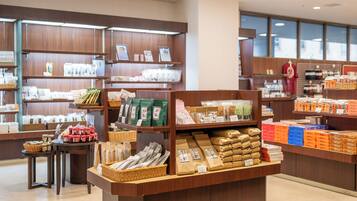 A store with shelves stocked with various packaged goods, including snacks and food items.