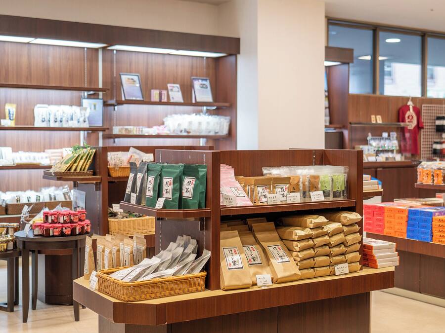 A store with shelves stocked with various packaged goods, including snacks and food items.