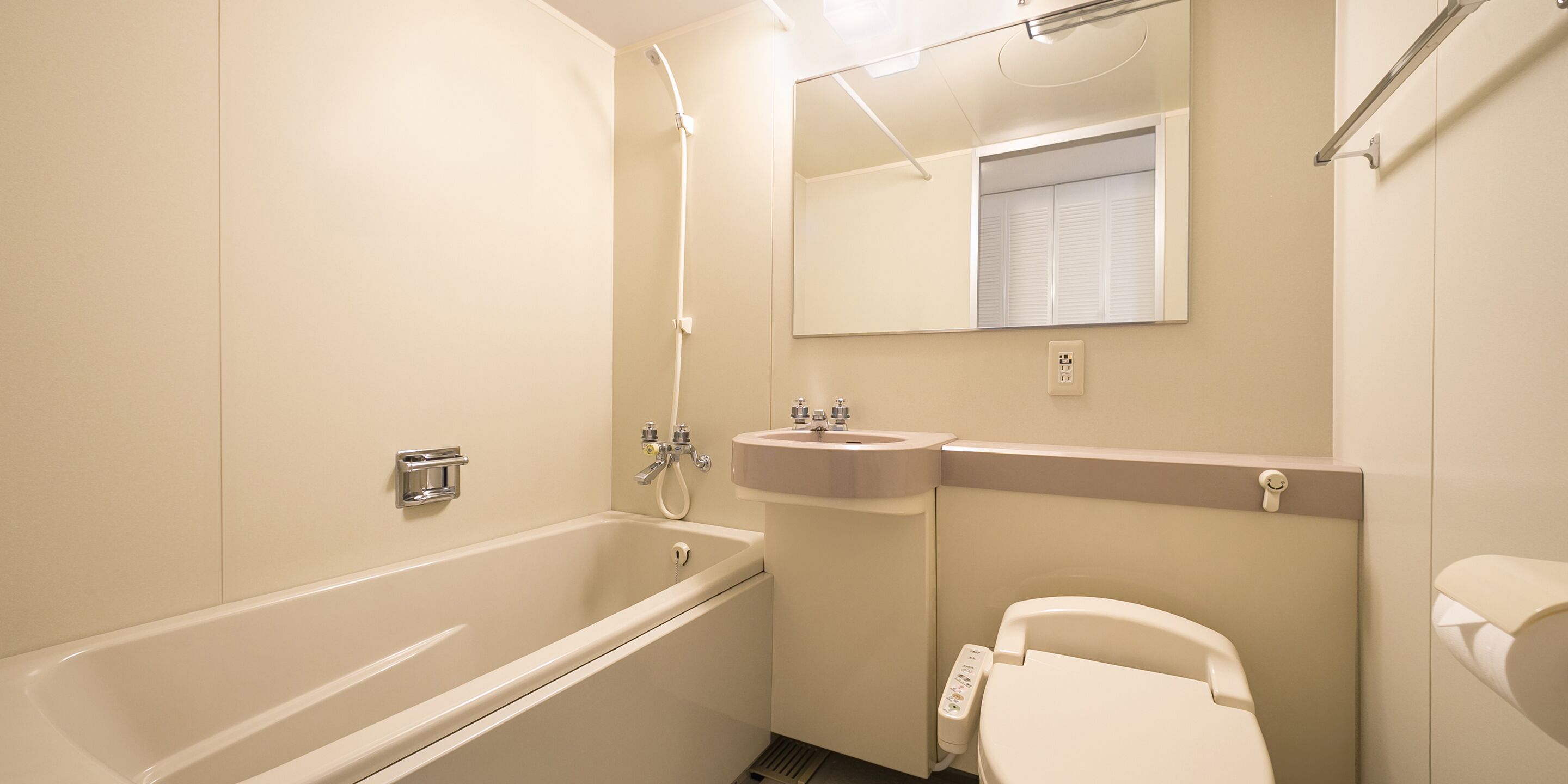 hair dryer, slippers, electronic bidet, towels