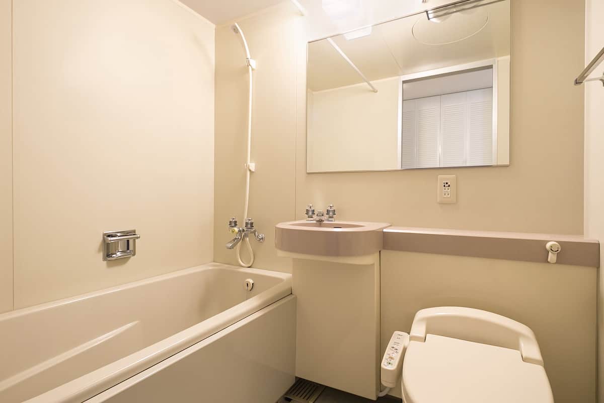 hair dryer, slippers, electronic bidet, towels