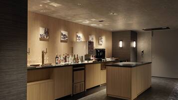 A modern kitchen with wooden cabinetry, a central island, and a built-in coffee machine.
