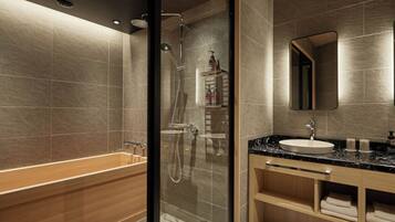 Combined shower/tub, free toiletries, hair dryer, slippers