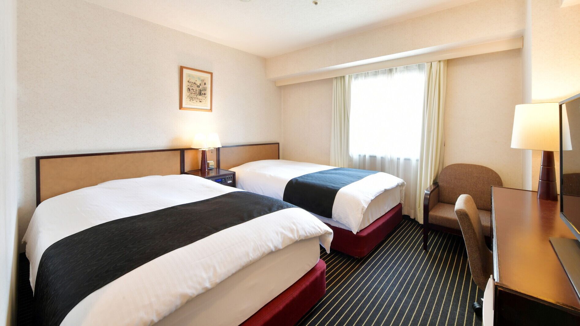 Down comforters, memory foam beds, desk, blackout drapes