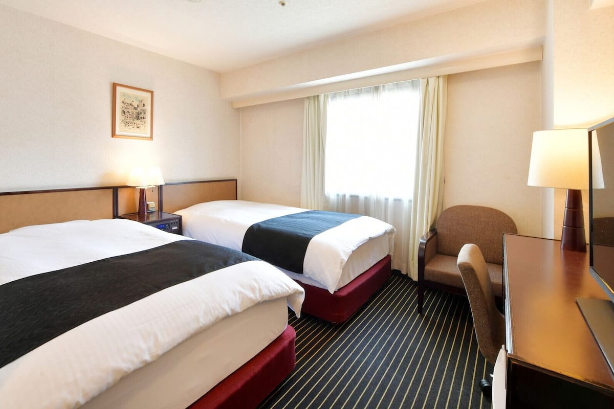 Down duvets, memory-foam beds, desk, blackout curtains