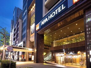 The exterior of the APA Hotel with a clear entrance, a visible staircase, and a sign indicating the hotel's name. - APA Hotel Nagoya Sakae Ekimae EXCELLENT (Nagoya)