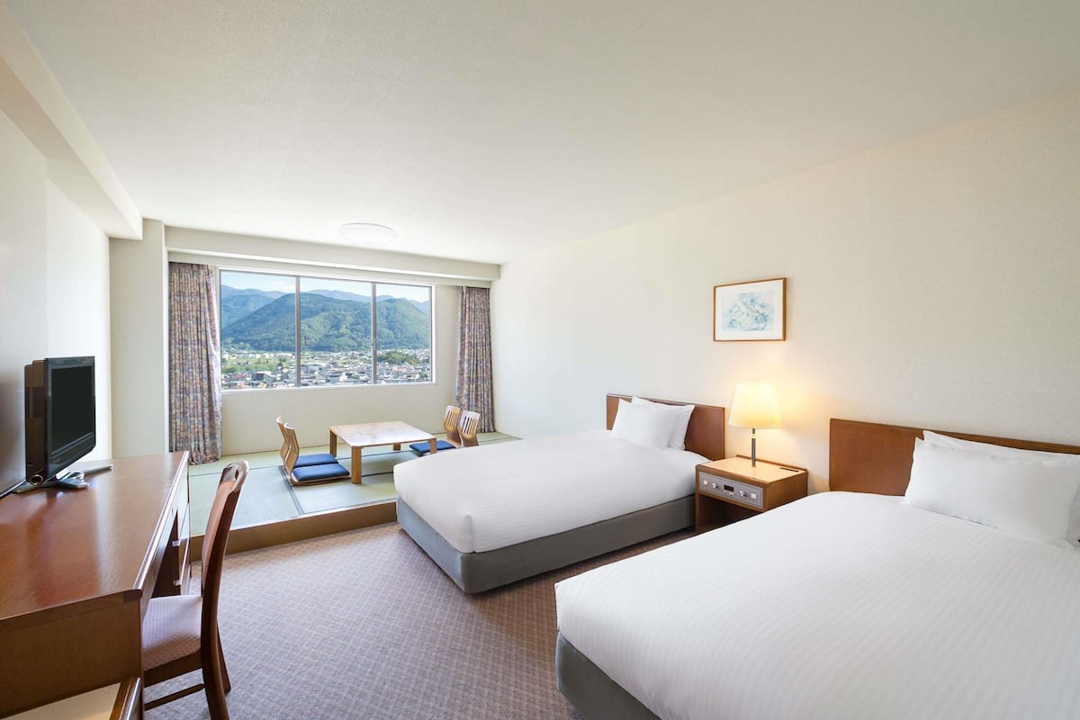 classic room, japanese style, 2 single beds and 2 futon beds, mountain view | in-room safe, desk, iron/ironing board, free wifi