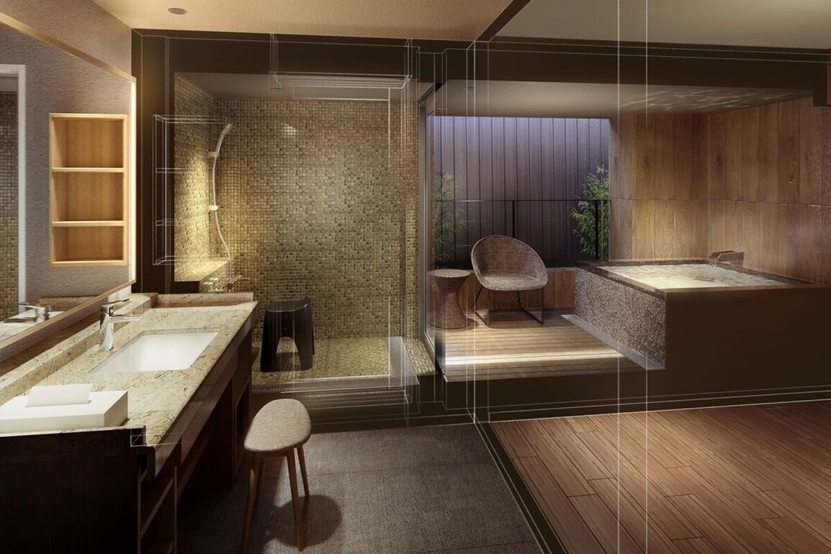 Ein modernes Badezimmer mit einer gläsernen Duschkabine, Holzboden und einer großen Badewanne.