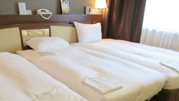 Standard Triple Room, Smoking | Down comforters, in-room safe, desk, blackout drapes