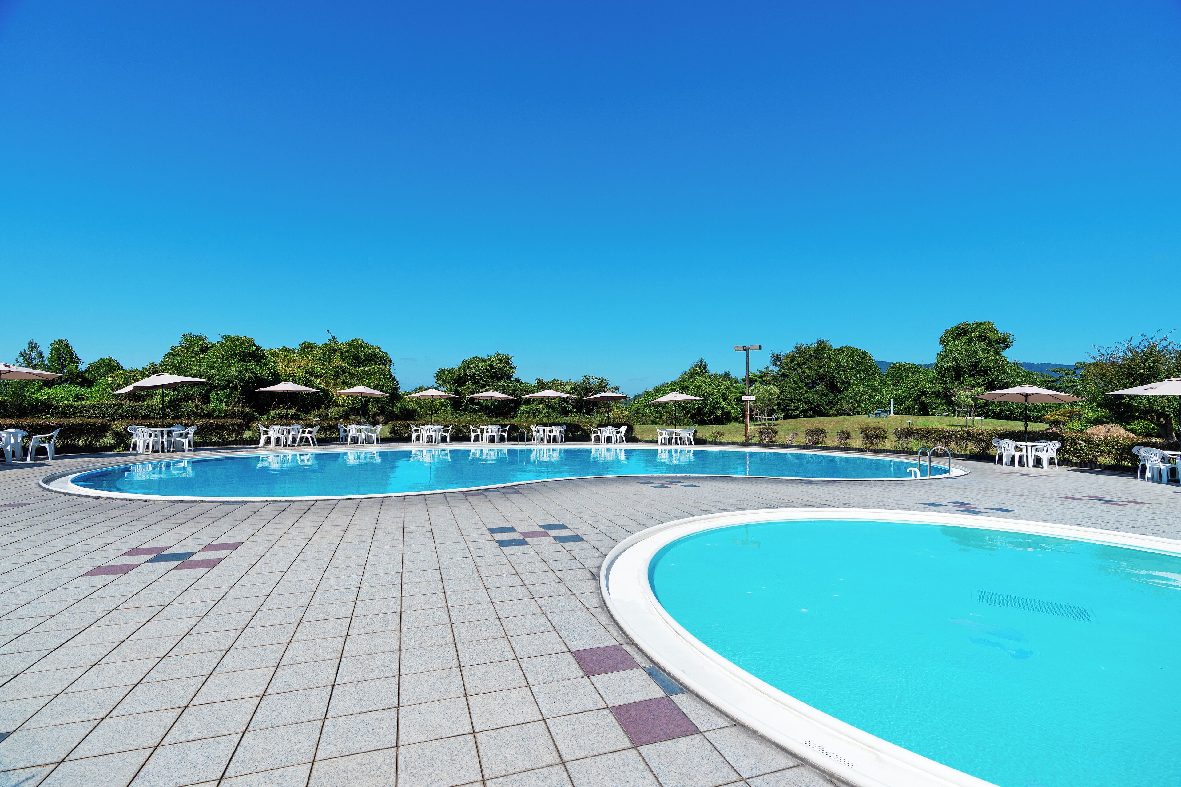 Seasonal outdoor pool, open 9:00 AM to 5:30 PM, pool umbrellas