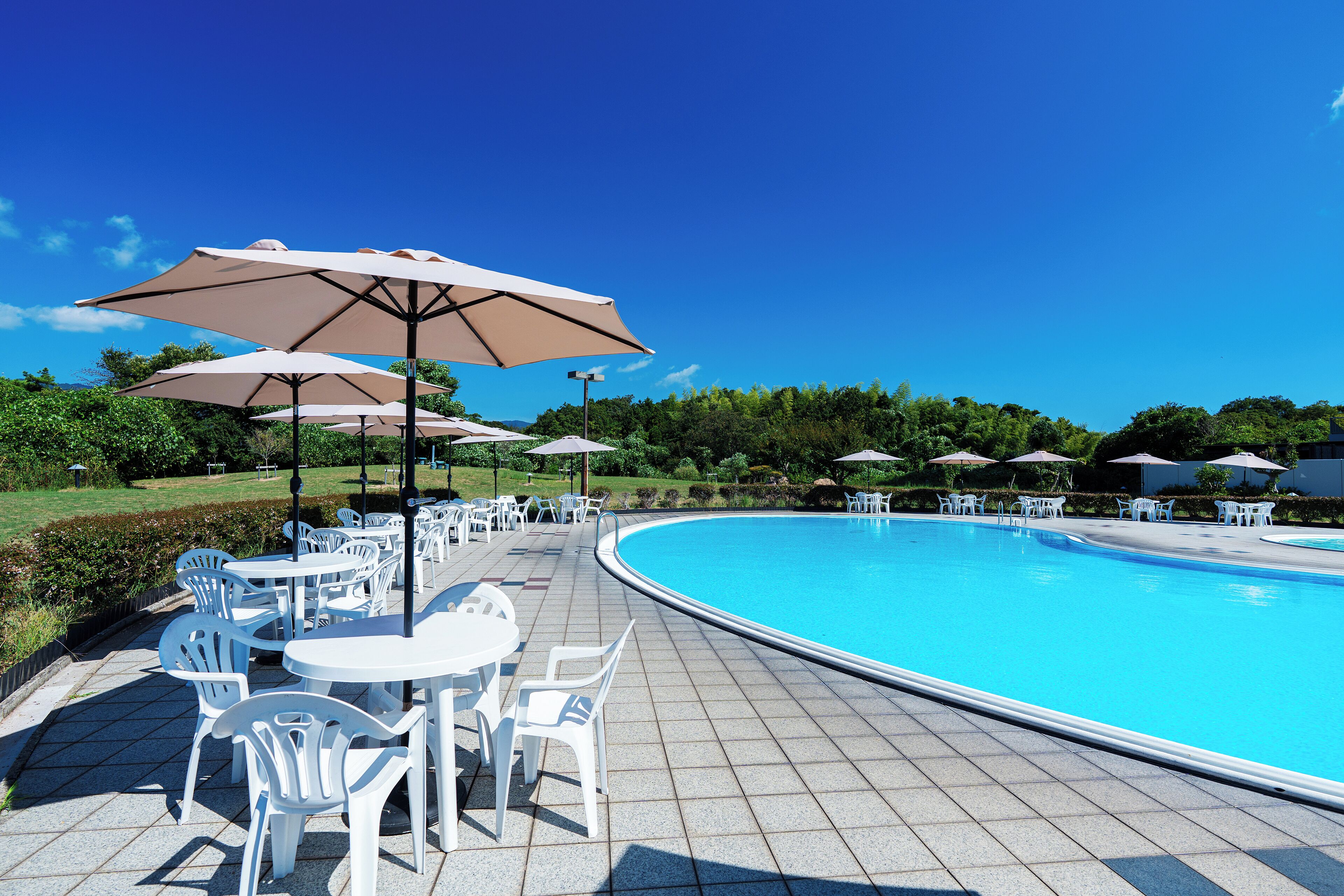 Seasonal outdoor pool, open 9:00 AM to 5:30 PM, pool umbrellas