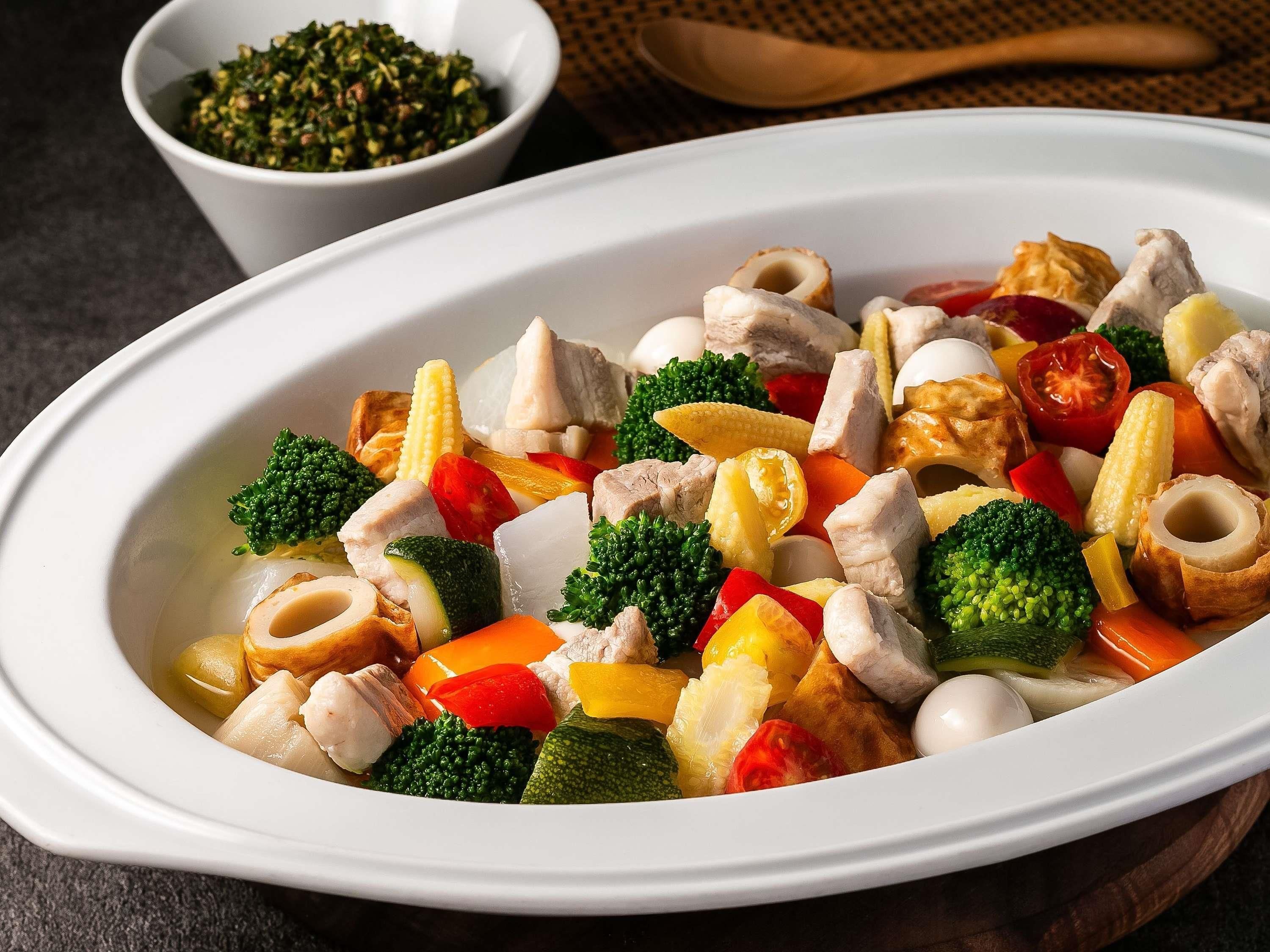 A bowl of mixed vegetables and chicken.