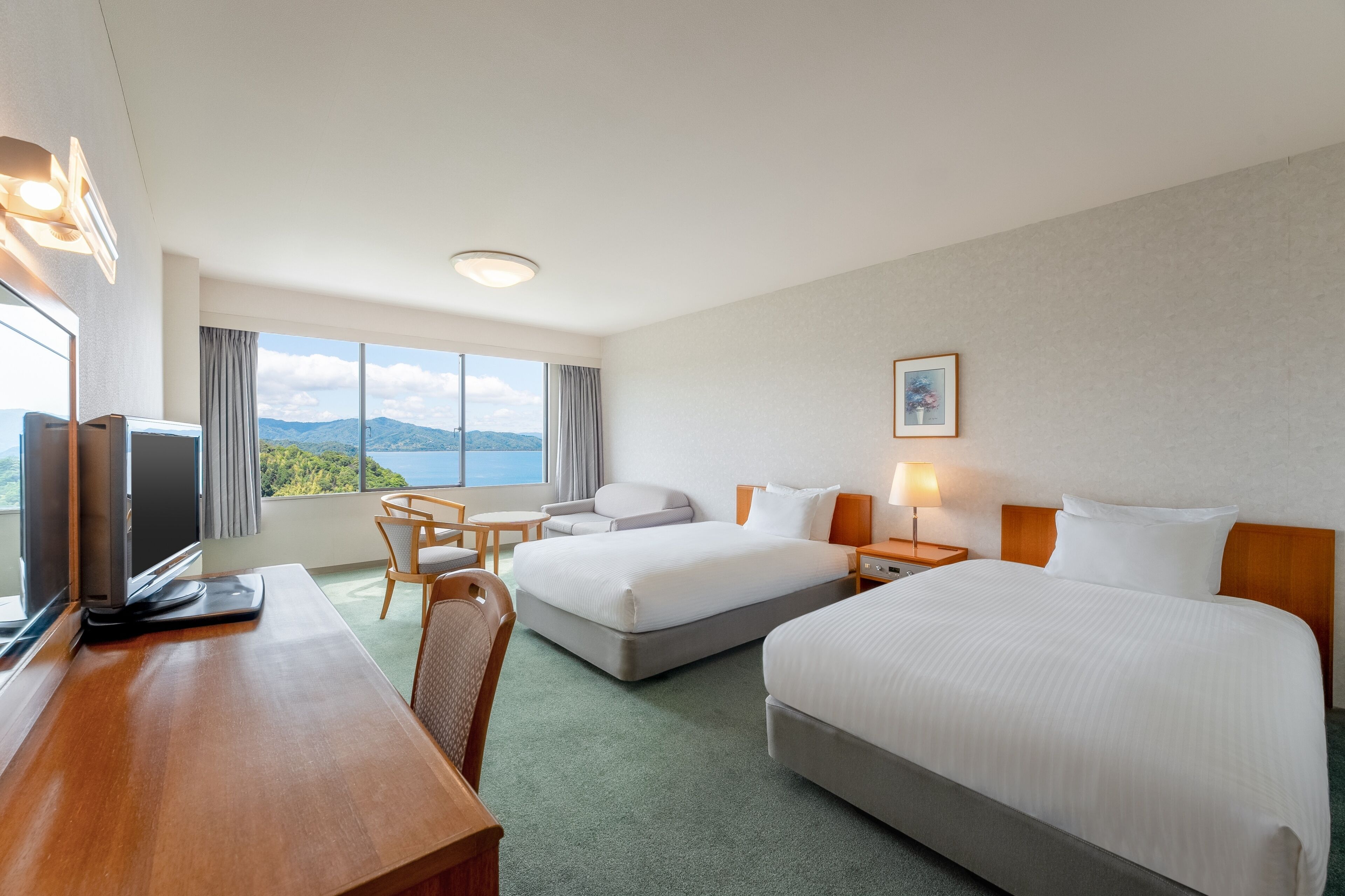 Classic Room, Multiple Beds, Sea View | In-room safe, desk, WiFi (free), bed sheets