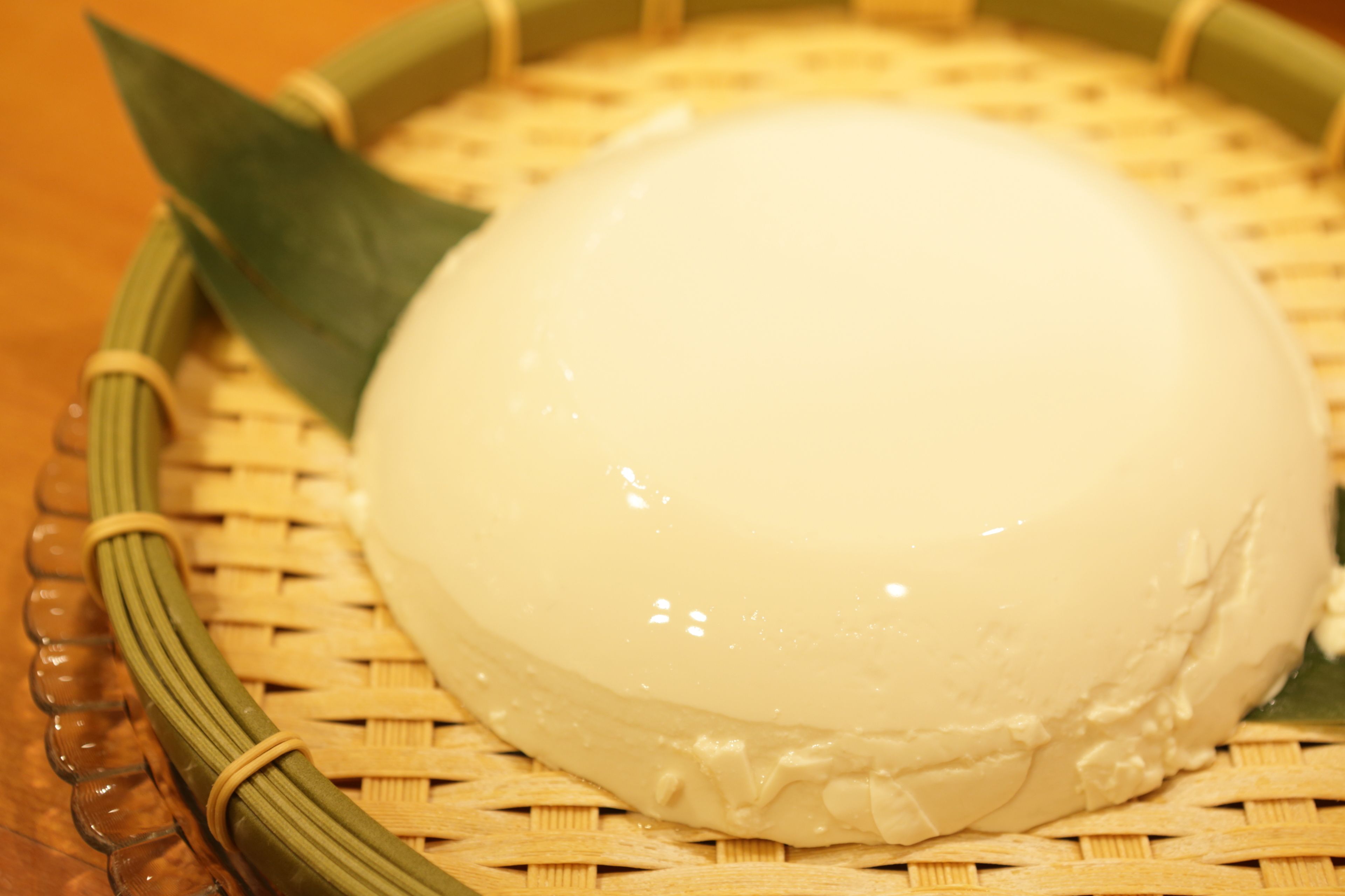 A round, white object on a woven basket.