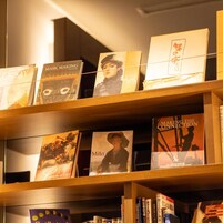 A bookshelf with various books, including titles like 'Mask Making' and 'Making the Connection'.