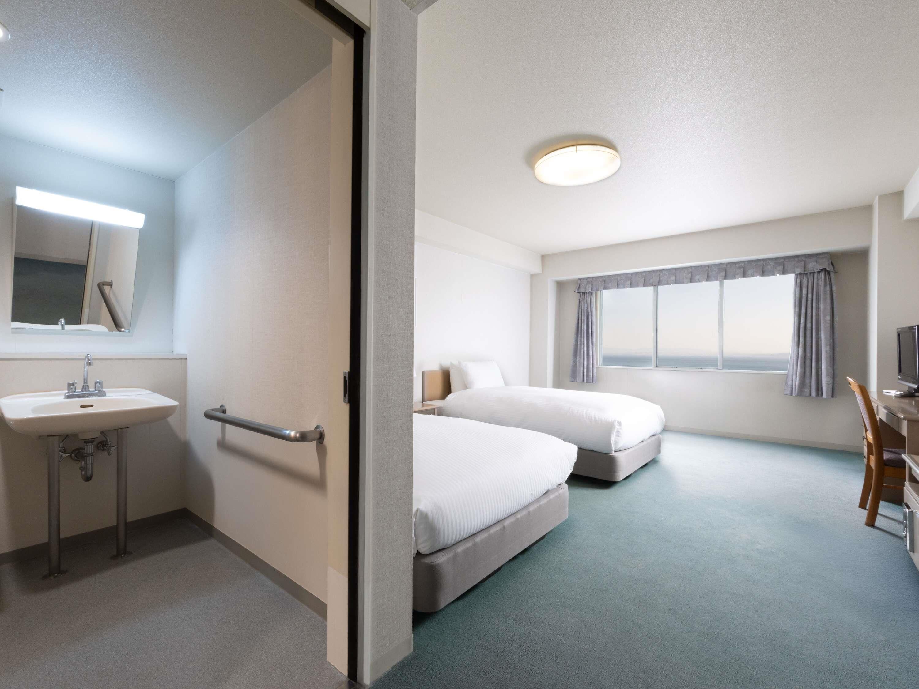 Classic-huone, 2 yhden hengen sänkyä, merinäköala | Tallelokero huoneessa, työpöytä, ilmainen Wi-Fi, vuodevaatteet