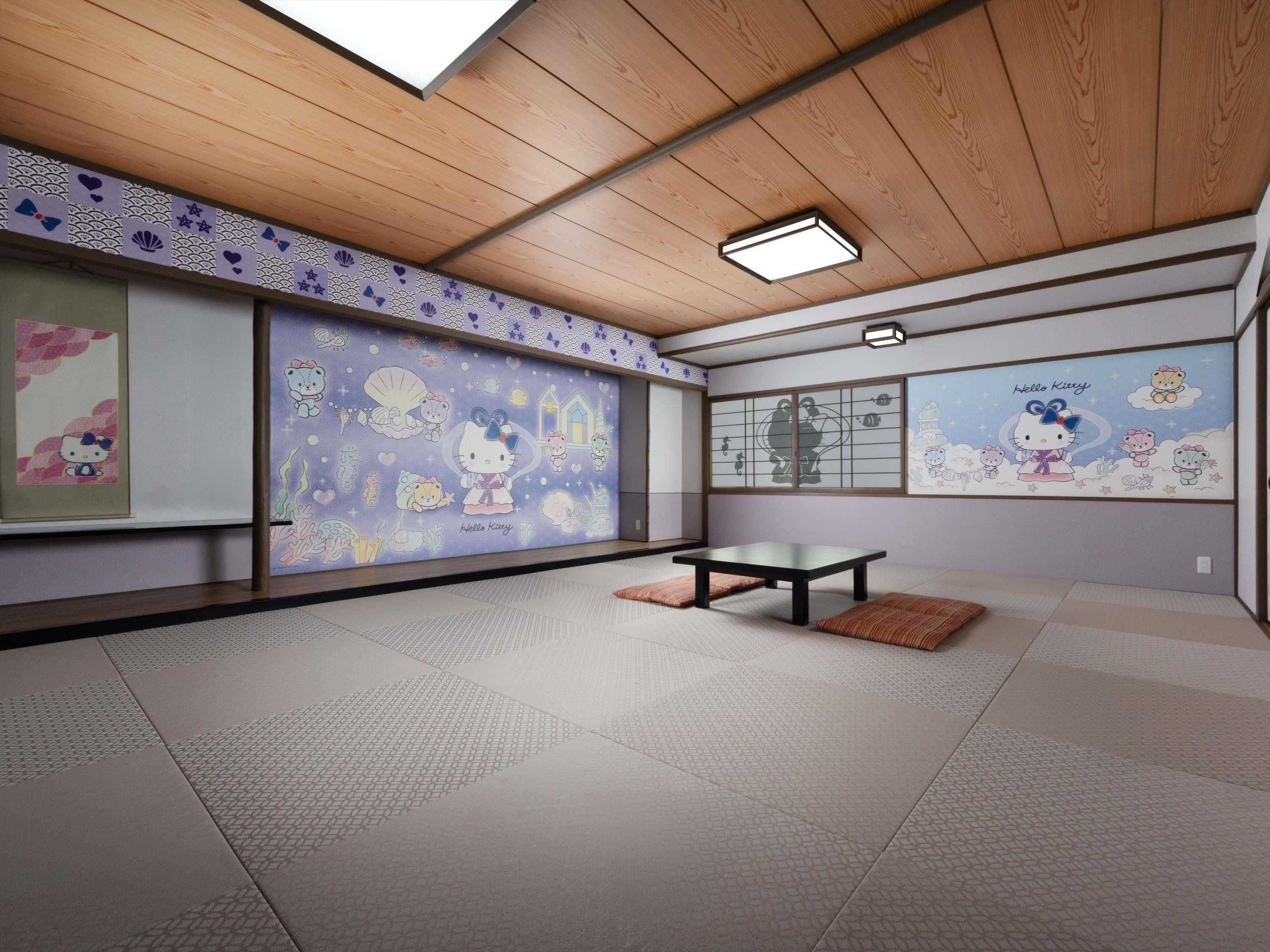 A room with tatami flooring, a low table, and wall decorations featuring Hello Kitty.